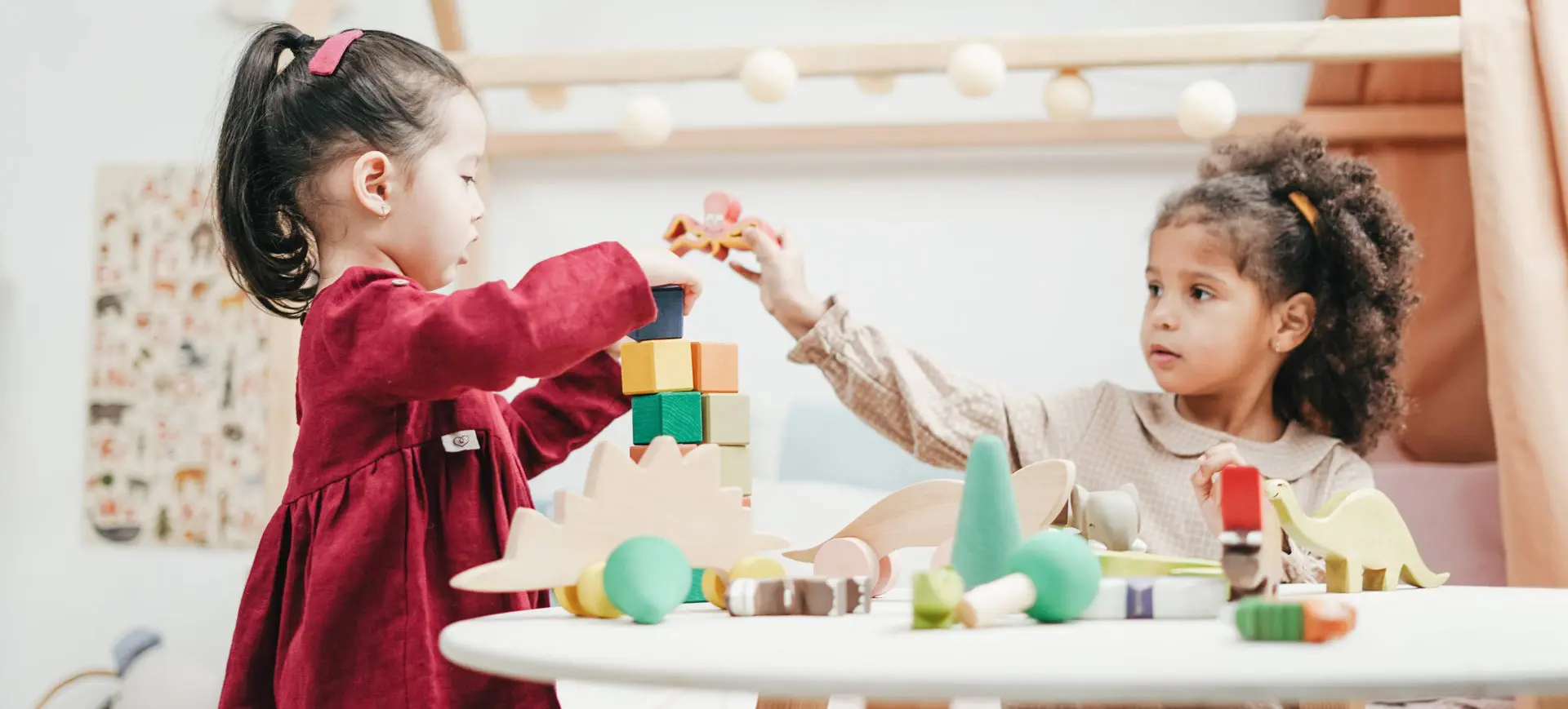 A child playing with blocks at the table